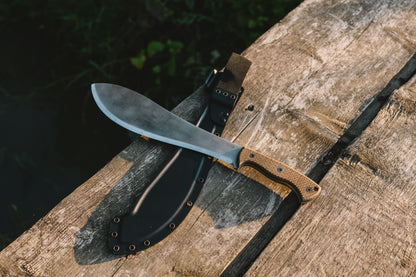 Bamboo knife with sheath on a wooden surface