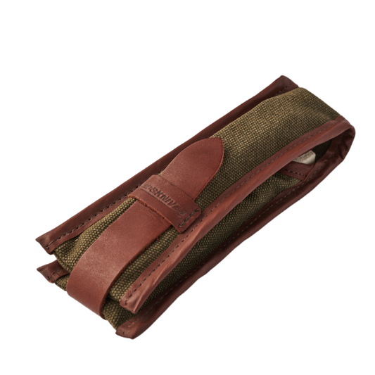 Green fabric belt with brown leather strap on a white background