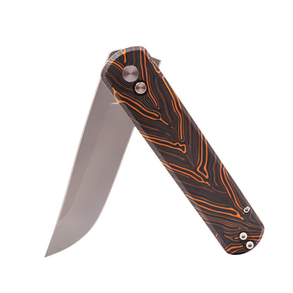 Folding knife with a patterned handle on a white background